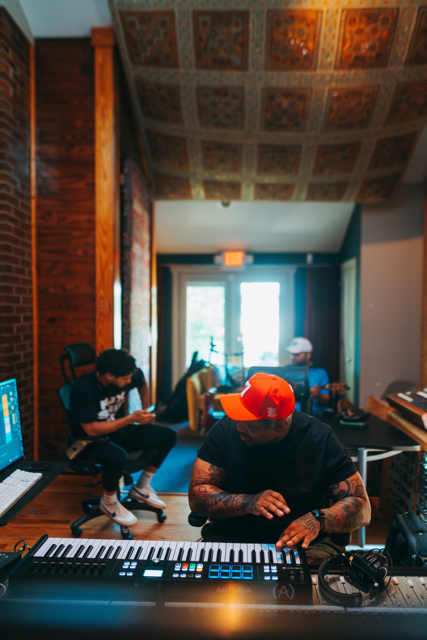 WLPWR developing music with artists during a private studio session